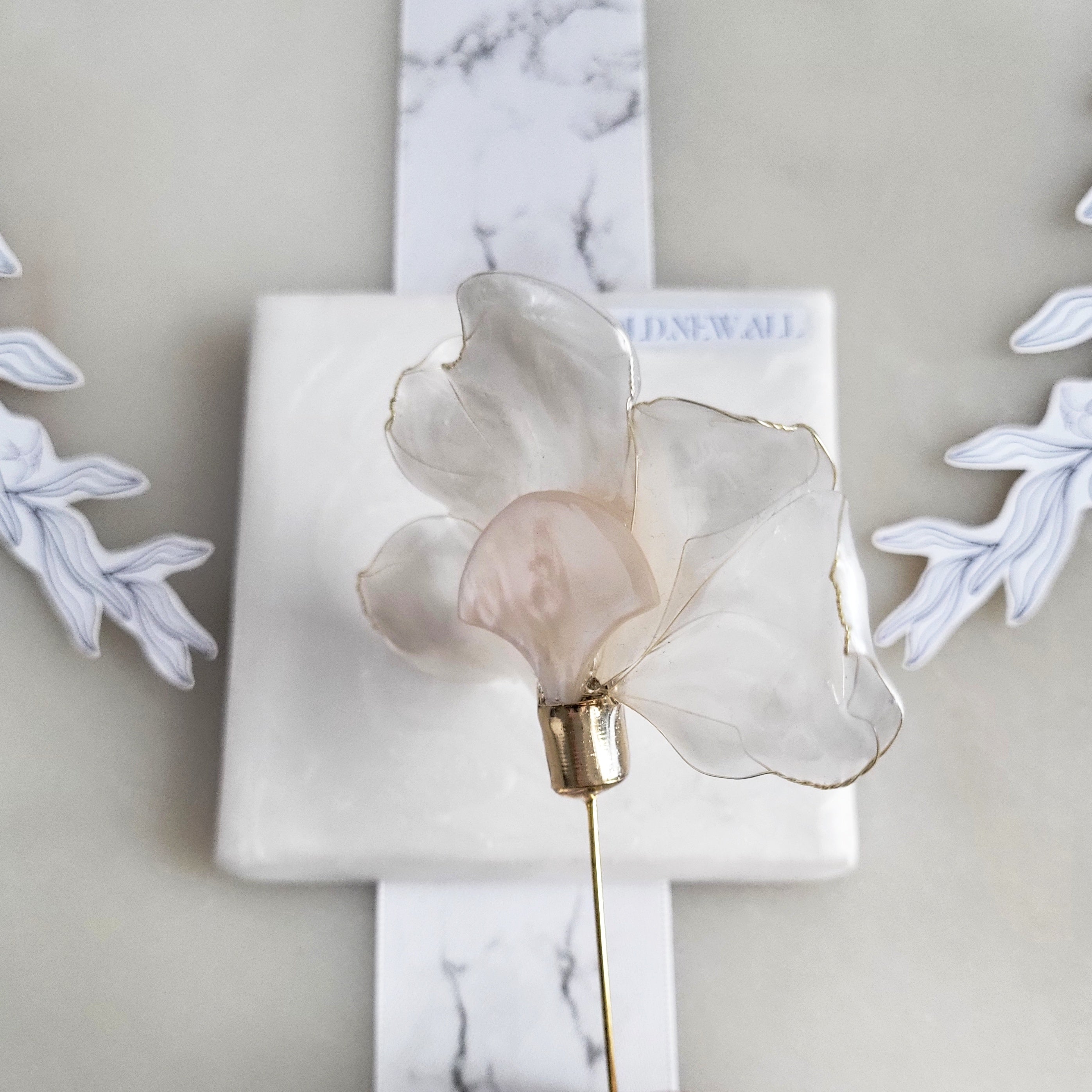 Handcrafted extra large mother of pearl silk flower brooch in white orchid design with gold wire petals and secure pin findings.