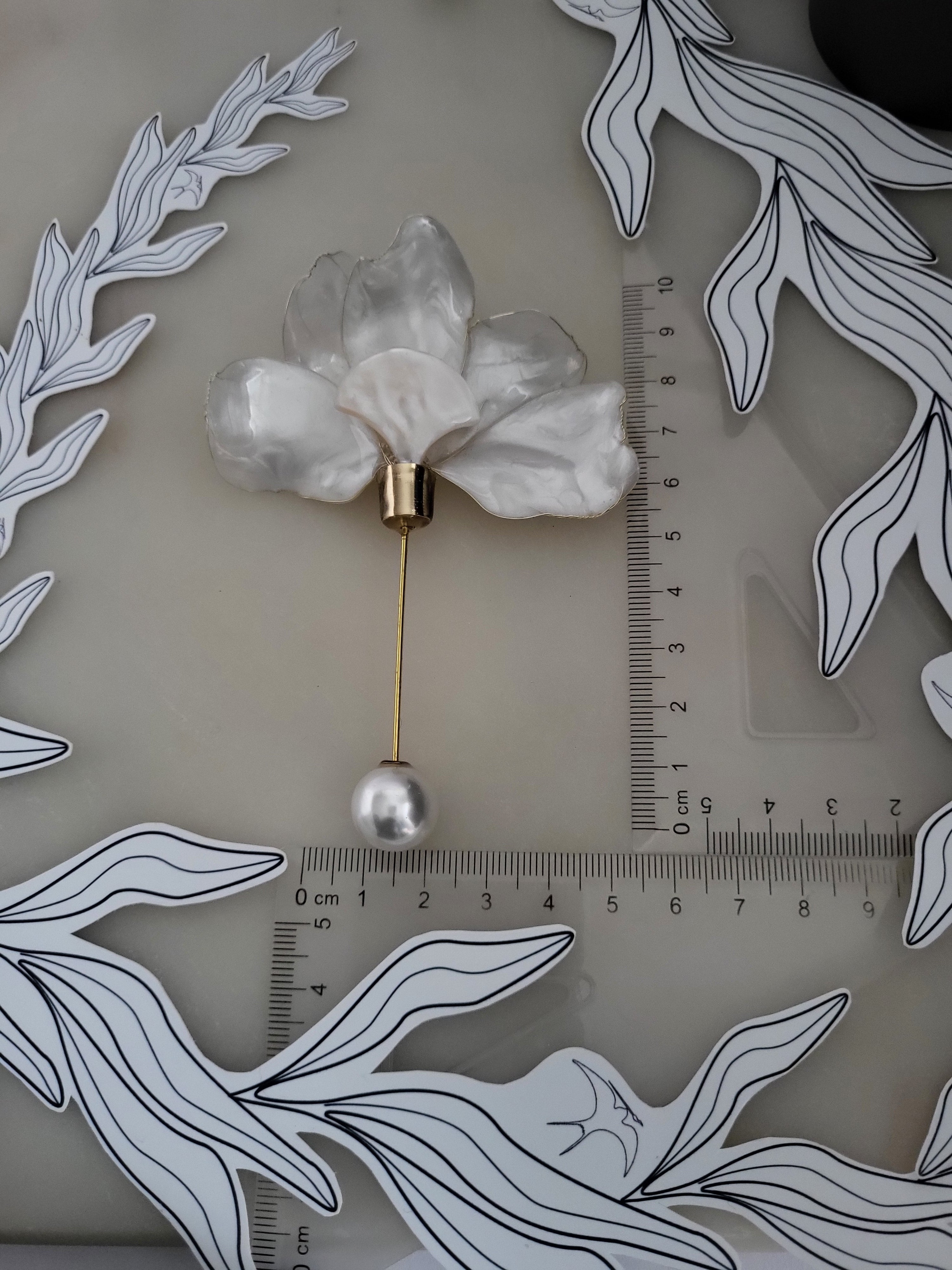 Handcrafted extra large mother of pearl silk flower brooch in white orchid design with gold wire petals and secure pin findings with ruler 