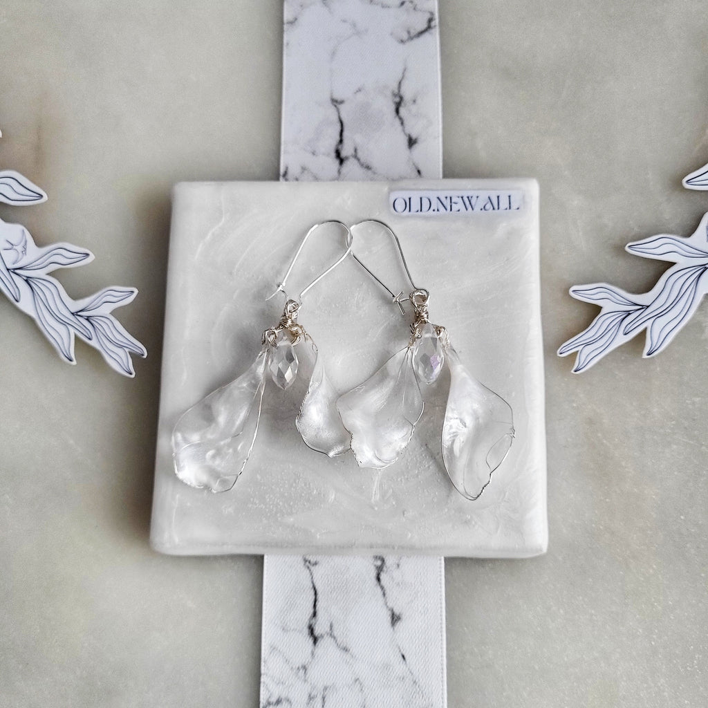 Handcrafted white mother-of-pearl resin earrings on silver french hooks with clear crystal suncatcher waterdrops