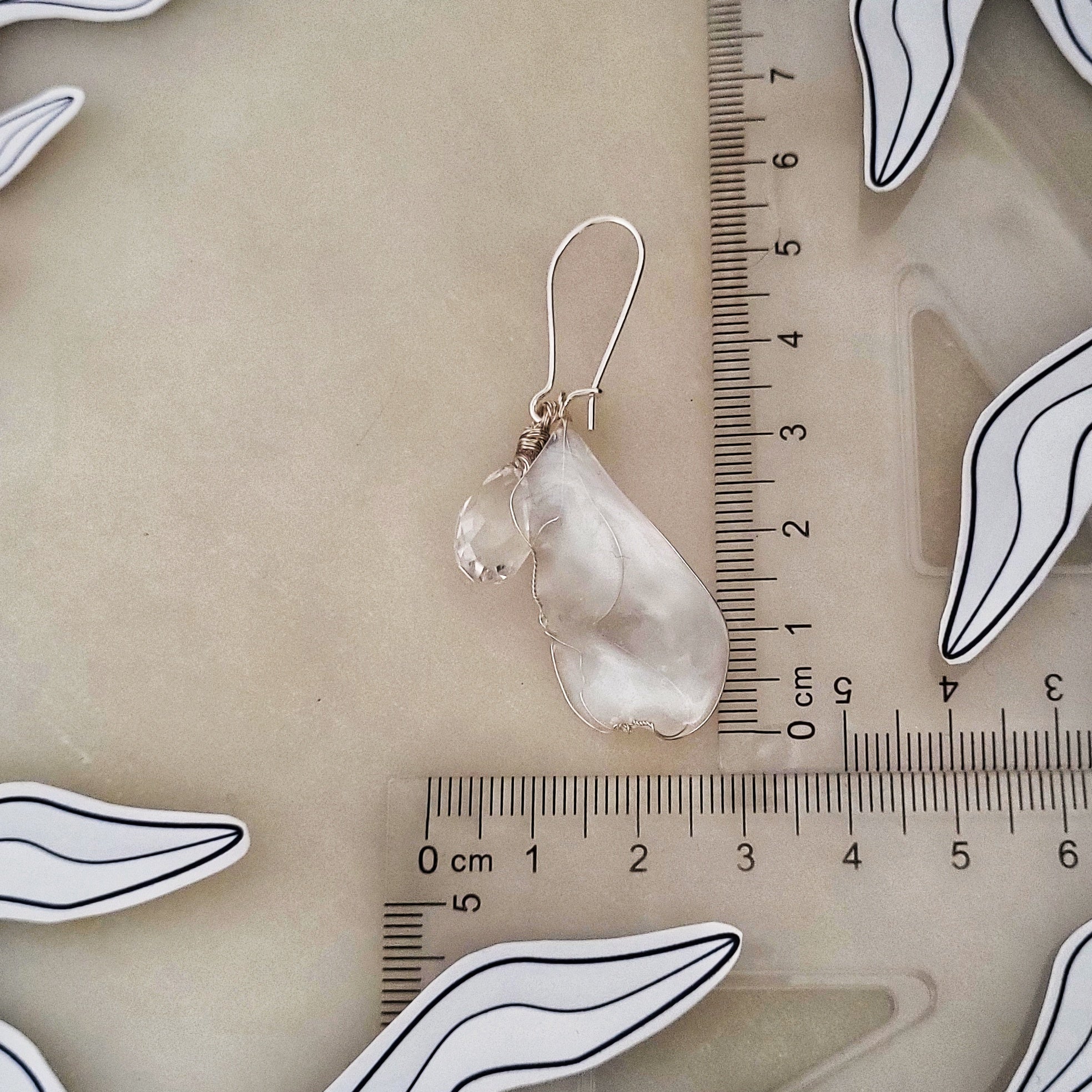 Handcrafted white mother-of-pearl resin earrings on silver french hooks with clear crystal suncatcher waterdrops with ruler