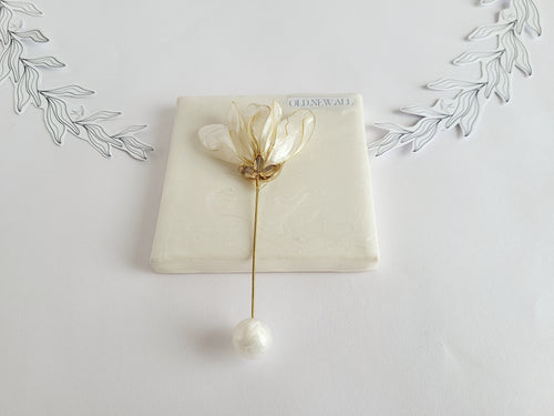 Handcrafted extra large mother of pearl silk flower brooch in white orchid design with gold wire petals and secure pin findings.