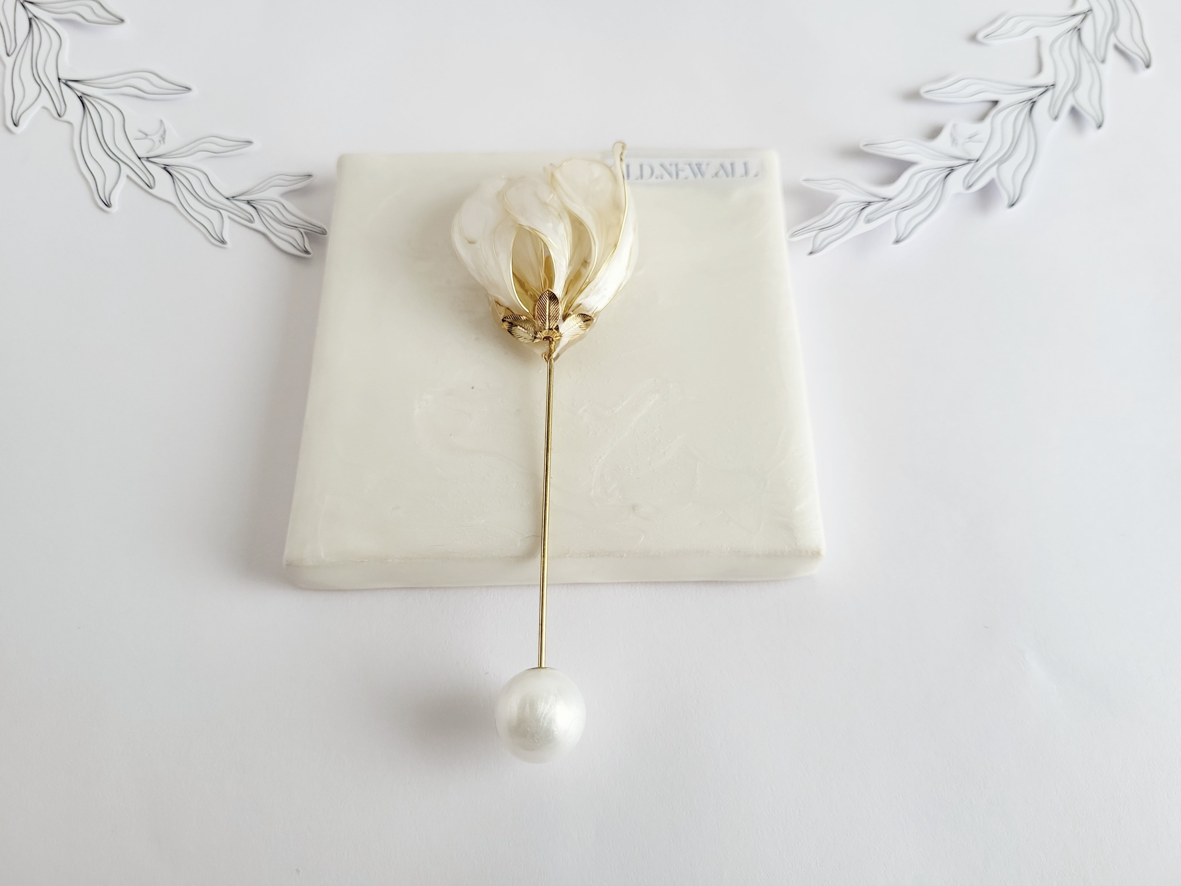 Handcrafted extra large mother of pearl silk flower brooch in white orchid design with gold wire petals and secure pin findings.