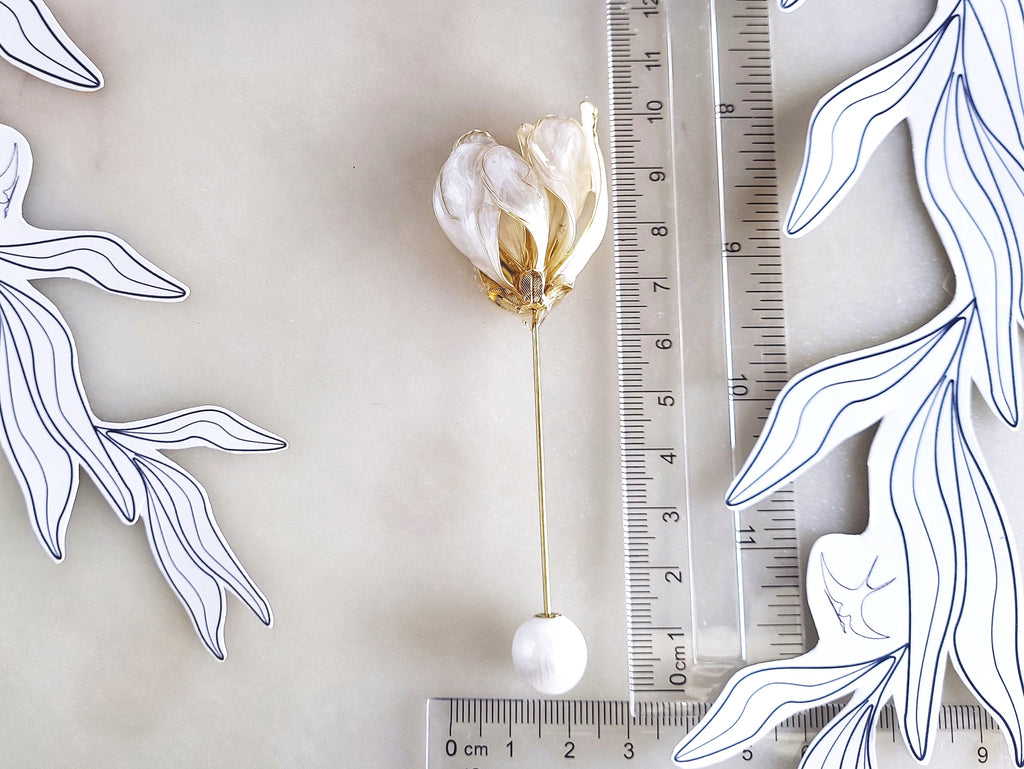 Handcrafted extra large mother of pearl silk flower brooch in white orchid design with gold wire petals and secure pin findings with ruler 