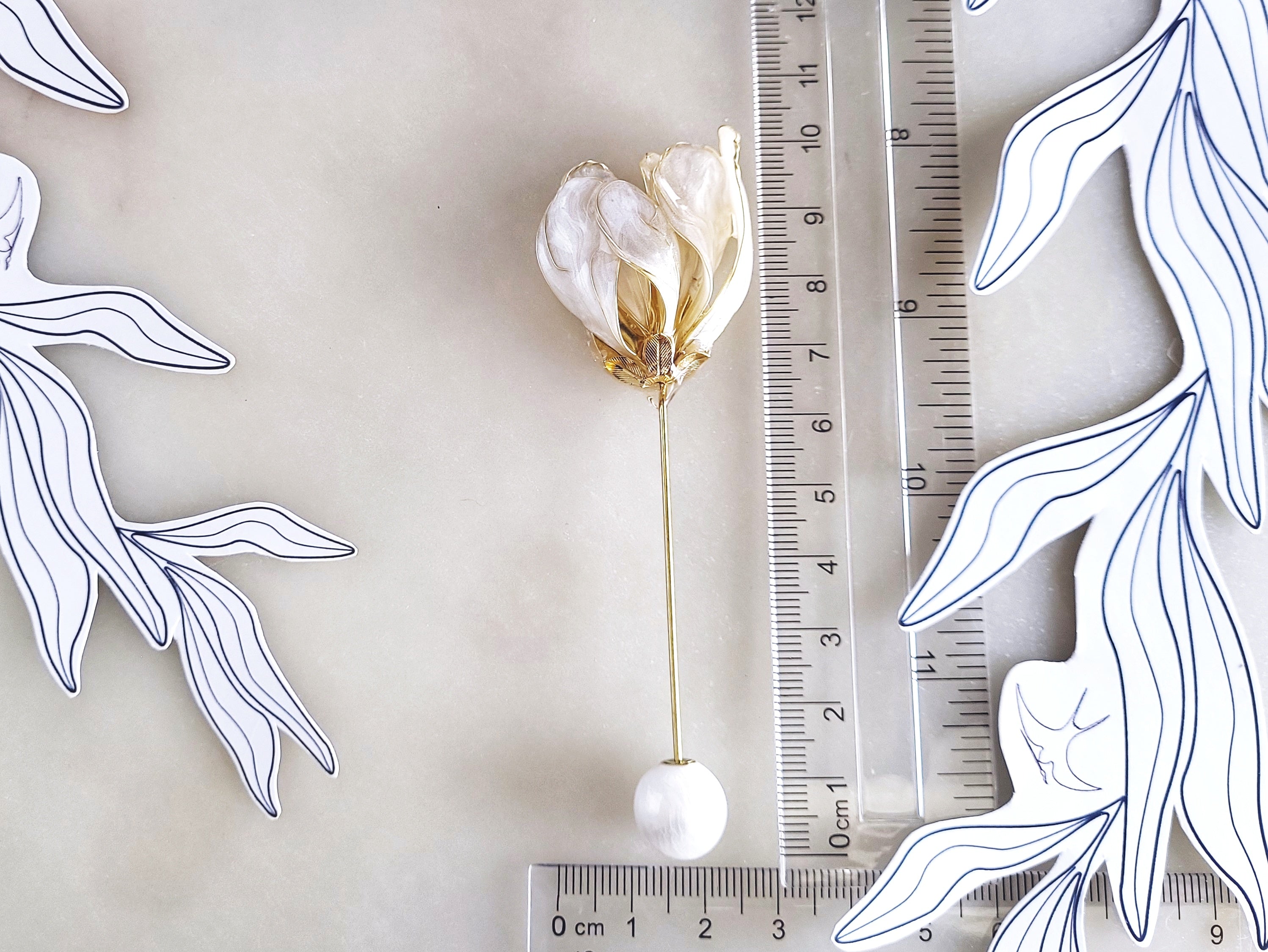 Handcrafted extra large mother of pearl silk flower brooch in white orchid design with gold wire petals and secure pin findings with ruler 