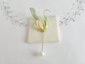 Handcrafted extra large mother of pearl silk flower brooch in white orchid design with gold wire petals and secure pin findings.
