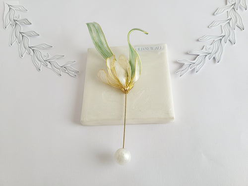 Handcrafted extra large mother of pearl silk flower brooch in white orchid design with gold wire petals and secure pin findings.