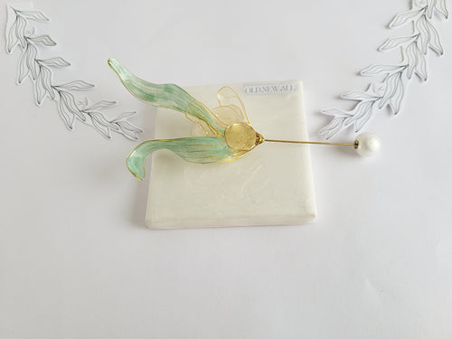 BACK of Handcrafted extra large mother of pearl silk flower brooch in white orchid design with gold wire petals and secure pin findings.