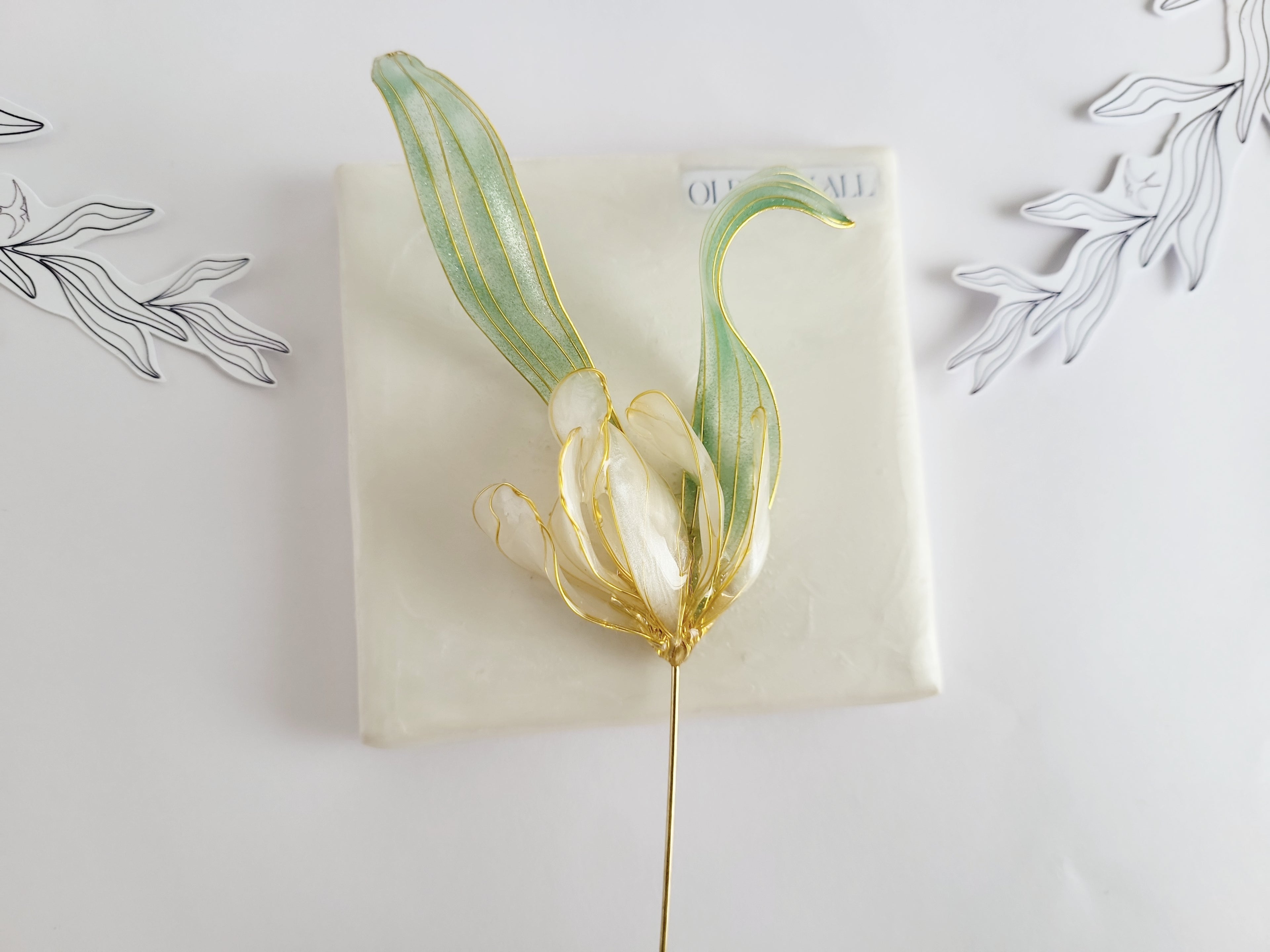 Handcrafted extra large mother of pearl silk flower brooch in white orchid design with gold wire petals and secure pin findings.