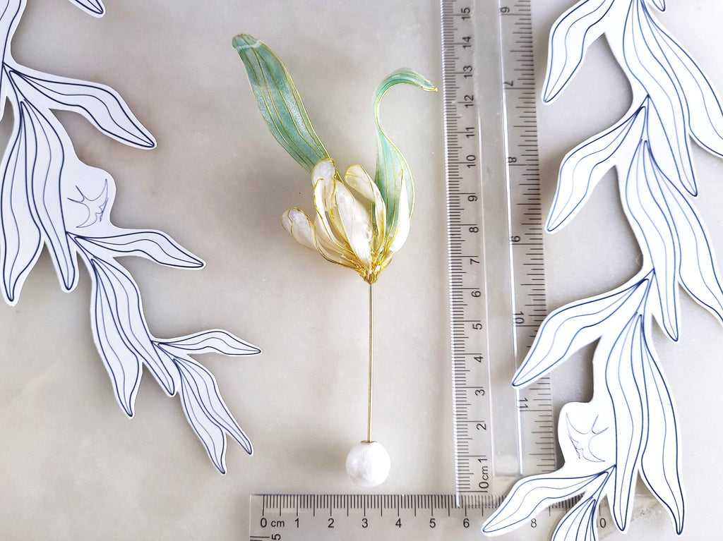 Handcrafted extra large mother of pearl silk flower brooch in white orchid design with gold wire petals and secure pin findings with ruler 