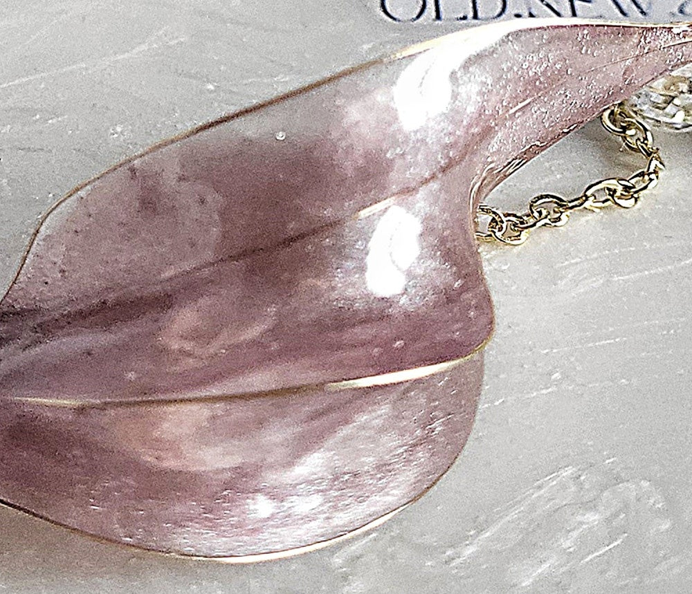 Handcrafted long golden wire earrings featuring pink cat eye resin flowers on a delicate chain with zirconia studs, waterdrop crystals, and raindrop dangles.